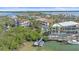 Waterfront property with boat dock and multiple homes visible at 4136 Roberts Point Cir, Sarasota, FL 34242