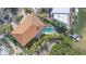 Bird's-eye view of luxury home, pool, and private dock at 4136 Roberts Point Cir, Sarasota, FL 34242