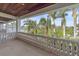 Relaxing balcony overlooking lush tropical landscape and waterways at 4136 Roberts Point Cir, Sarasota, FL 34242