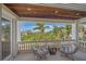 Private balcony with comfortable seating and scenic views at 4136 Roberts Point Cir, Sarasota, FL 34242