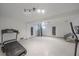 Basement with home gym, elevator, and ample space at 4136 Roberts Point Cir, Sarasota, FL 34242