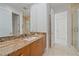 Elegant bathroom with granite countertop and walk-in shower at 4136 Roberts Point Cir, Sarasota, FL 34242