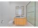 Modern bathroom with a large glass shower, a floating vanity, and neutral color palette at 4136 Roberts Point Cir, Sarasota, FL 34242