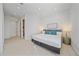 King-size bed in a calm and bright bedroom with ensuite access at 4136 Roberts Point Cir, Sarasota, FL 34242