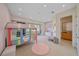 Bright bedroom with a colorful bunk bed, a small sofa, and access to a balcony at 4136 Roberts Point Cir, Sarasota, FL 34242