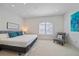 Main bedroom with king bed, window seat, and calming decor at 4136 Roberts Point Cir, Sarasota, FL 34242