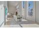 Modern dining room with large windows and high ceilings at 4136 Roberts Point Cir, Sarasota, FL 34242
