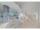Grand entryway featuring a glass elevator and modern decor at 4136 Roberts Point Cir, Sarasota, FL 34242