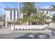 Luxury home with a gated entrance and meticulously maintained landscaping at 4136 Roberts Point Cir, Sarasota, FL 34242