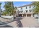 Beautiful home with a large driveway and mature landscaping at 4136 Roberts Point Cir, Sarasota, FL 34242