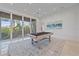 Game room with pool table and access to balcony and water views at 4136 Roberts Point Cir, Sarasota, FL 34242