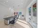 Bright home office with large desk and access to balcony at 4136 Roberts Point Cir, Sarasota, FL 34242