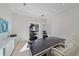 Spacious home office with a large desk and stunning art at 4136 Roberts Point Cir, Sarasota, FL 34242