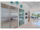 Stainless steel appliances and a large refrigerator highlight this modern kitchen at 4136 Roberts Point Cir, Sarasota, FL 34242