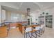 Upscale kitchen with sleek cabinetry, large island, and high-end appliances at 4136 Roberts Point Cir, Sarasota, FL 34242
