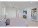 Spacious main bedroom with a large bed, a dresser, and access to a private balcony at 4136 Roberts Point Cir, Sarasota, FL 34242