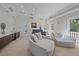 Relaxing media room with comfortable seating and access to a balcony at 4136 Roberts Point Cir, Sarasota, FL 34242