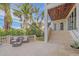 Back patio with seating area and tranquil garden views at 4136 Roberts Point Cir, Sarasota, FL 34242