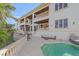 Outdoor patio with seating area and pool access at 4136 Roberts Point Cir, Sarasota, FL 34242