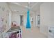 Playful ' room with a hanging swing and art wall at 4136 Roberts Point Cir, Sarasota, FL 34242
