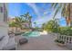 Inviting pool area with lounge chairs and tranquil view at 4136 Roberts Point Cir, Sarasota, FL 34242