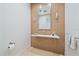 Elegant powder room featuring a modern vanity and tile at 4136 Roberts Point Cir, Sarasota, FL 34242