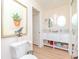 Clean bathroom with double vanity, large mirror and modern fixtures at 4207 Caddie E Dr # 202, Bradenton, FL 34203