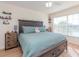 Spacious bedroom with king-size bed, large window, and ceiling fan at 4207 Caddie E Dr # 202, Bradenton, FL 34203