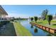 Peaceful canal-side view with lush greenery and golf course visible at 4207 Caddie E Dr # 202, Bradenton, FL 34203