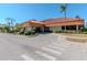 Community building featuring a welcoming entrance and landscaping at 4207 Caddie E Dr # 202, Bradenton, FL 34203