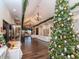 Elegant community room with hardwood floors, chandeliers, and large Christmas tree at 4207 Caddie E Dr # 202, Bradenton, FL 34203