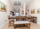 Charming dining room features a wooden table with bench seating at 4207 Caddie E Dr # 202, Bradenton, FL 34203