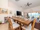 Bright dining room with a large wooden table and seating for six at 4207 Caddie E Dr # 202, Bradenton, FL 34203