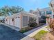 Three-car garage with white doors and decorative lattice at 4207 Caddie E Dr # 202, Bradenton, FL 34203