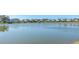 Serene lake view with waterfront homes and clear blue sky at 4207 Caddie E Dr # 202, Bradenton, FL 34203