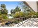 Spacious balcony overlooking a tranquil waterway and lush tropical landscape at 5112 Jungle Plum Rd, Sarasota, FL 34242