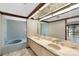 Bathroom with double vanity, tiled shower and bathtub at 5112 Jungle Plum Rd, Sarasota, FL 34242