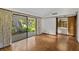 Spacious bedroom with parquet floors and access to private patio at 5112 Jungle Plum Rd, Sarasota, FL 34242