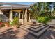 Back patio features multiple steps leading up to the home's entrance at 5112 Jungle Plum Rd, Sarasota, FL 34242