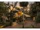 Two-story home with brick driveway, lush landscaping, and palm trees at 5112 Jungle Plum Rd, Sarasota, FL 34242