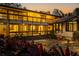 Evening view of two-story home with lit windows and patio at 5112 Jungle Plum Rd, Sarasota, FL 34242
