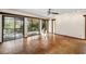 Gathering room with sliding doors leading to a patio and hardwood floors at 5112 Jungle Plum Rd, Sarasota, FL 34242