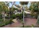 Brick driveway leads to house with garage at 5112 Jungle Plum Rd, Sarasota, FL 34242