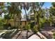 Front view of house with palm trees at 5112 Jungle Plum Rd, Sarasota, FL 34242