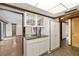 Retro kitchen with light wood cabinets, granite countertops, and tile floors at 5112 Jungle Plum Rd, Sarasota, FL 34242