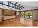 Spacious living area with hardwood floors and built-in shelving at 5112 Jungle Plum Rd, Sarasota, FL 34242