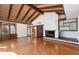 Bright living room with hardwood floors and wood-beamed ceilings at 5112 Jungle Plum Rd, Sarasota, FL 34242
