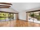 Bright living room with hardwood floors and sliding glass doors at 5112 Jungle Plum Rd, Sarasota, FL 34242