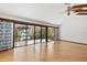 Large living room with hardwood floors and water views at 5112 Jungle Plum Rd, Sarasota, FL 34242