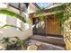 Small patio with sliding glass doors and lush greenery at 5112 Jungle Plum Rd, Sarasota, FL 34242